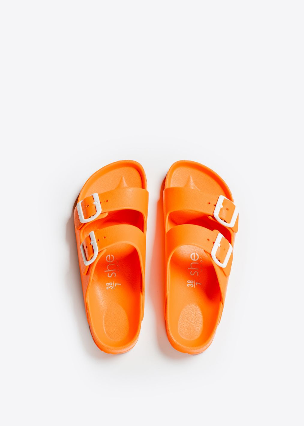 A pair of vegan friendly summer slides in bright orange