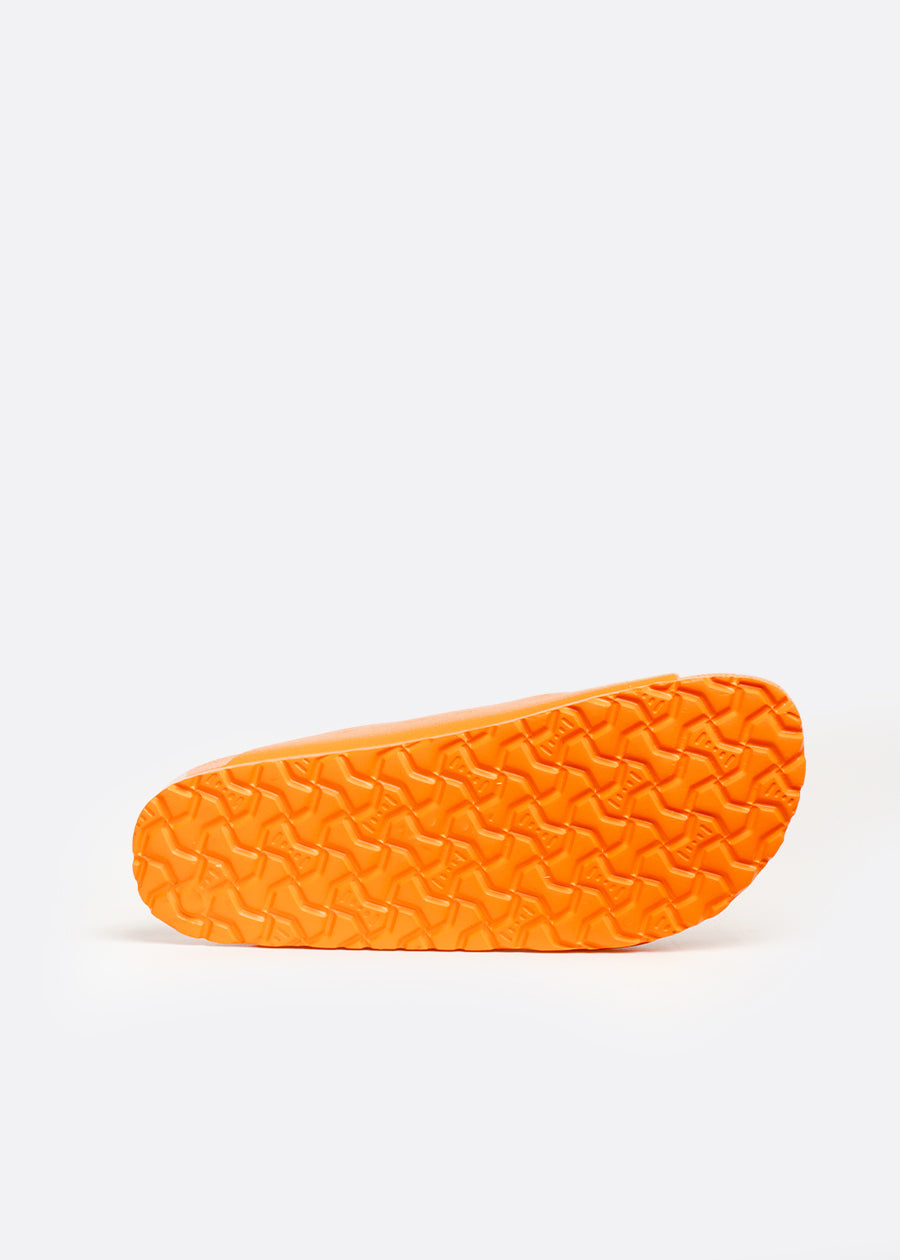 Slip resistant EVA outsole on an orange sandal